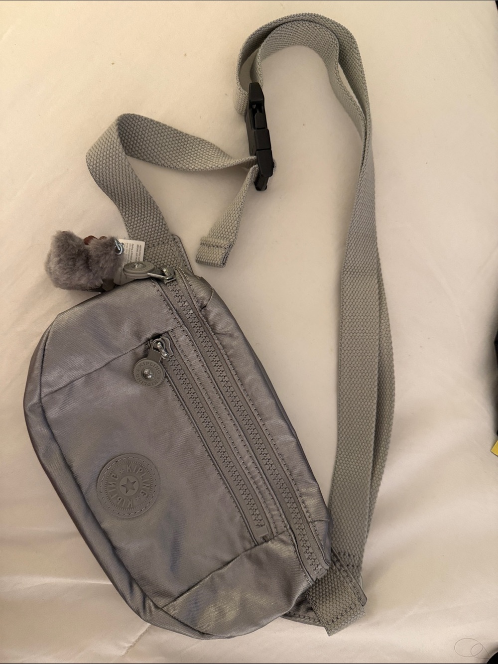 Kipling Metallic Silver Belt Bag with Plush Key Charm